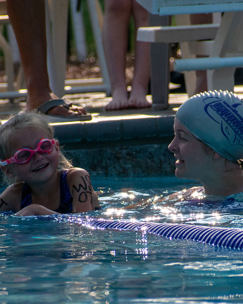 Cady with a shrimper during a neighborhood swim meet